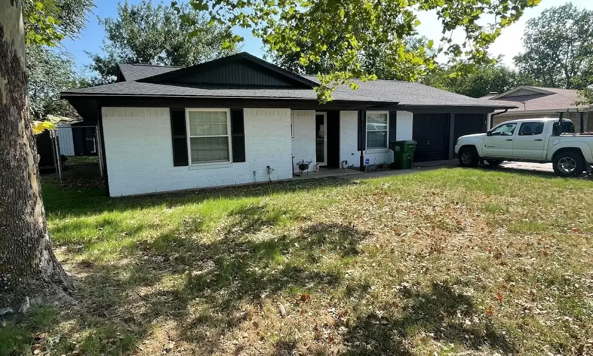 Professional roofing crew working on a residential roof in Hilmar-Irwin